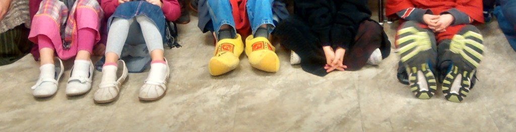 Little feet in Mommy or Daddy's big shoes.